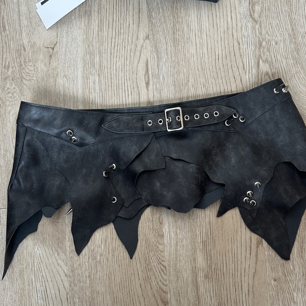 SOLD do not purchase Namilia Shredded Black Faux Leather Grommet Belt Skirt